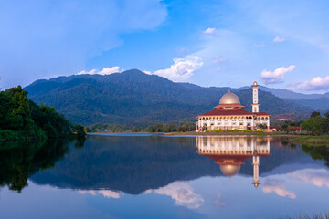Wall Mural - Beautiful view of Darul Quran mosque with reflections during sunset at Kuala Kubu, Selangor, Malaysia. The image may has blurred effect and soft focus due to long exposure.