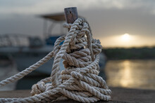 Tied Up Rope On A Dock With Early Morning Light 