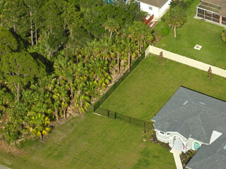 Wall Mural - Aerial view of typical contemporary american private house with roof top covered with asphalt shingles and green lawn on yard