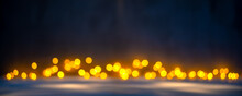 Christmas Blurred Texture Background With Bokeh Lights And Light Reflections On Snow