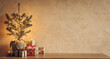 Small Christmas tree with lights and gift boxes on old wooden table on cozy textured stone wall background