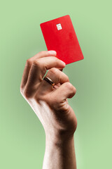 Poster - Man's hand holding credit card.