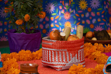 Mexican offering (ofrenda) with all the elements that make up the altar to the dead in Mexican customs, bread, fruits, drinks, flowers