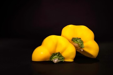 Poster - Yellow bellpepper or capsicum isolated on black background