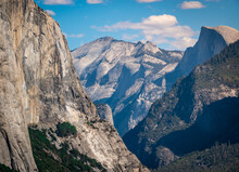 View Of Yosemite Valley From Tunnel View Scenic Viewpoint, Zoomed In To Highlight The Sheer Granite Wall Cliffs Of El Capitan (left) And Half Dome (right).