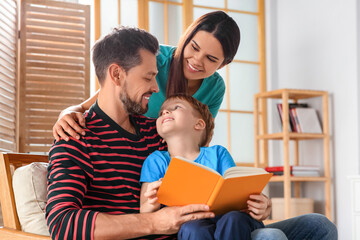 Poster - Happy family reading book together at home