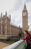 Fototapeta Big Ben - Asian female tourists Travel in London, England at the Big Ben Clock Tower area.Concept of foreign tourism After the epidemic situation of covid.