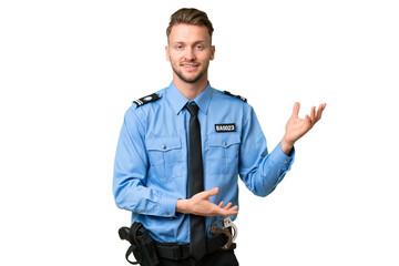 Wall Mural - Young police man over isolated background extending hands to the side for inviting to come