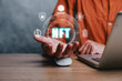© Mongta Studio - NFT token digital crypto art blockchain technology concept, Person hand holding virtual screen NFT icon background.
