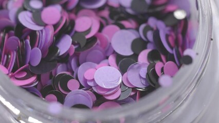 Poster - purple sequins in a jar rotate in a circle