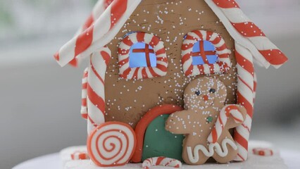 Wall Mural - Christmas house with a gingerbread man