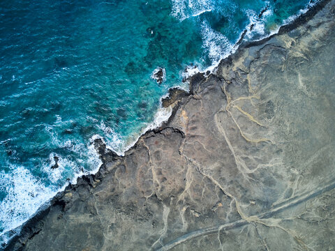 Abstract photo Jandia natural park diagonal line Aerial view of the Atlantic Ocean and the coastline in Eye's beach Tiger tigre ojos Fuerteventura island drone photography
