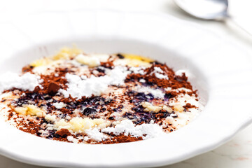 Wall Mural - semolina porridge with cocoa, sugar and melted butter