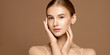 Skincare. Beauty portrait of a young woman with perfect skin posing against beige background.