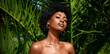 Green beauty portrait of African American model tropical fashion portrait. Beautiful woman posing against green exotic palm trees.