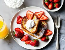 French Toast And Fresh Strawberries With Orange Juice For Breakfast