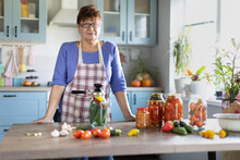 Woman In The Kitchen Canning Vegetables