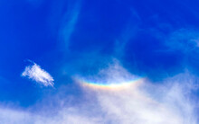 Beautiful And Rare Rainbow In Cloudy Sky Blue Background Mexico.
