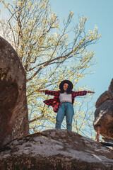 Poster - happy woman hiker on the top of the rock