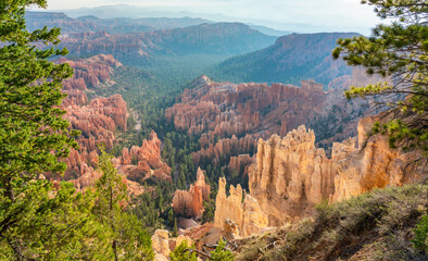 Wall Mural - Rising sun lighting up the hoodoos near Bryce Point overlook from the rim trail in the Bryce Canyon National Park 