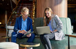 © Cavan Images - Business partners in a meeting discussing business data