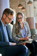 © Cavan Images - Business partners in a meeting discussing business data
