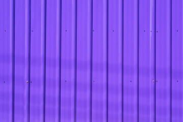 Wall Mural - Background of purple corrugated steel wall with sunlight and cable lines shadow on surface