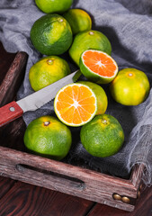 Wall Mural - Green orange, a fresh fruit rich in vitamins