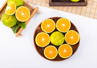 Wall Mural - Green orange, a fresh fruit rich in vitamins