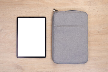 Poster - Mockup tablet with bag on wooden background