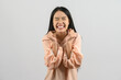 © Johnstocker - Portrait of Happy young asian woman in pink shirt exciting isolated on white background