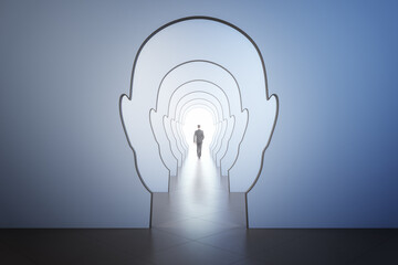 Success psychology and business motivation concept with walking man back leading to light spot in the end of corridor through walls in form of human heads