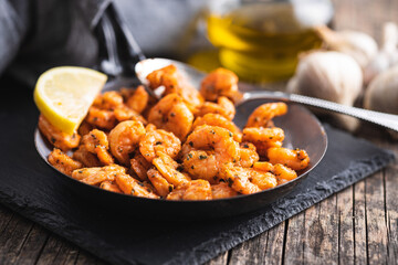 Grilled tiger shrimps on pan.