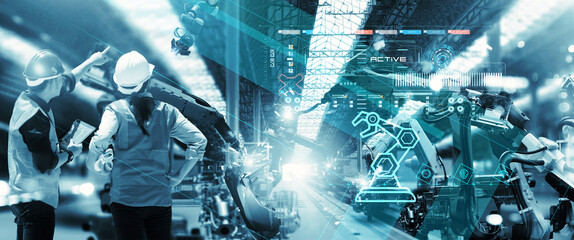 Fototapete - Industry 4.0 modern factory, Project Manager and female engineer  checking and analysis of robotics working in intelligent factory automotive industrial with monitoring system software. Blue tone.