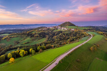 Germany, Baden-Wurttemberg, Drone View Of Country Road Stretching Toward Hohenstaufen Mountain