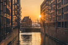 Germany, Hamburg, Canal In Speicherstadt District At Sunset
