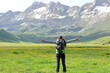 © Antonioguillem - Back view of a hiker celebrating vacation in nature