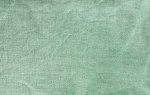 Green Denim Fabric Texture Background. Firm And Thick Cotton Fabric Backdrop.
