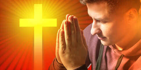 Wall Mural - Male prayer. Close up prayer's hand pray in church. Having put hands together in prayer or meditation. Prayer on background of cross. Concept of hope, faith, christianity, religion, church online.