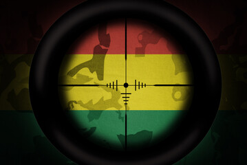 Wall Mural - sniper scope aimed at flag of bolivia on the khaki texture background. military concept. 3d illustration