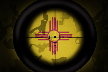 sniper scope aimed at flag of new mexico state on the khaki texture background. military concept. 3d illustration