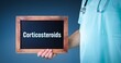 Corticosteroids. Doctor shows sign/board with wooden frame. Background blue