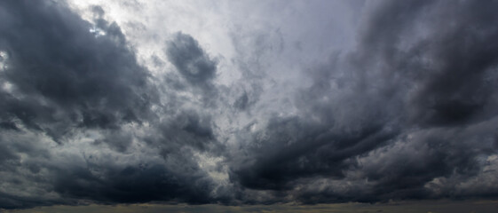 Aufkleber - The dark sky with heavy clouds converging and a violent storm before the rain.Bad or moody weather sky and environment. carbon dioxide emissions, greenhouse effect, global warming, climate change