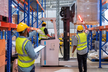 Wall Mural - African american working in warehouse hold red light give signal to truck loading carton box