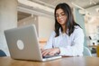 © Serhii - Beautiful Young Freelancer Woman Using Laptop Computer Sitting At Cafe Table. Happy Smiling Girl Working Online Or Studying And Learning While Using Notebook. Freelance Work, Business People Concept.
