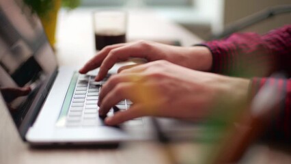 Wall Mural - close up of freelancer's developer hands typing program code on laptop keyboard in coworking. busine