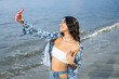© Hector Pertuz - Woman Laughing While Taking Selfie With Mobile Phone At The Beach