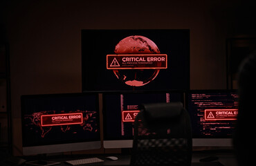 Leinwandbilder - Workplace of IT engineer or software developer in dark server room with group of computer screens showing critical error in working process