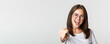 © Mix and Match Studio - Close-up of cheerful beautiful girl in glasses smiling, poiting finger at camera
