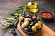 Mixed green olives and black olives with olive oil, healthy eating antioxidants